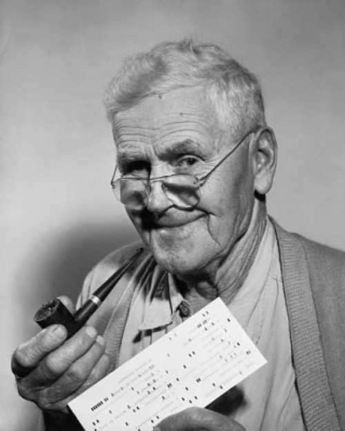 Close-up of a senior man holding a check and a pipe Poster Print - Item # VARSAL25512575