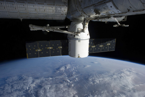 March 3, 2013 - The docking of SpaceX Dragon to the International Space Station above a cloud covered Earth Poster Print - Item # VARPSTSTK204602S