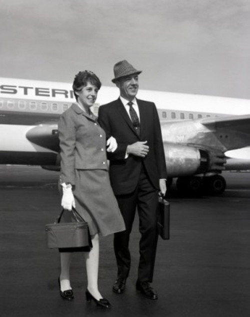 Mature couple at airport Poster Print - Item # VARSAL255416225