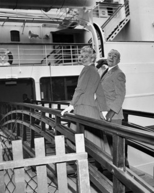 Rear view of a senior couple standing on a ship Poster Print - Item # VARSAL25528207