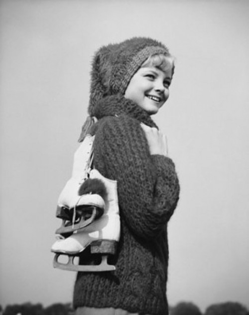 Teenage girl carrying ski boots and smiling Poster Print - Item # VARSAL25517272A