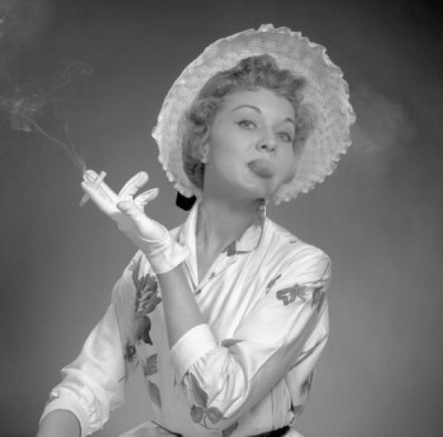 Portrait of young elegant young woman smoking cigarette Poster Print - Item # VARSAL25518462