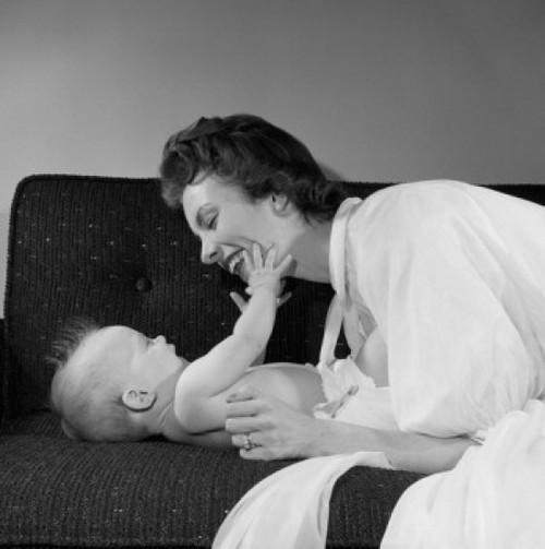 Mother with baby boy on sofa Poster Print - Item # VARSAL255417640B