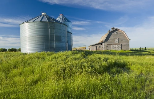 Old Barn With Metal Grain Bins; Ponteix Saskatchewan Canada PosterPrint