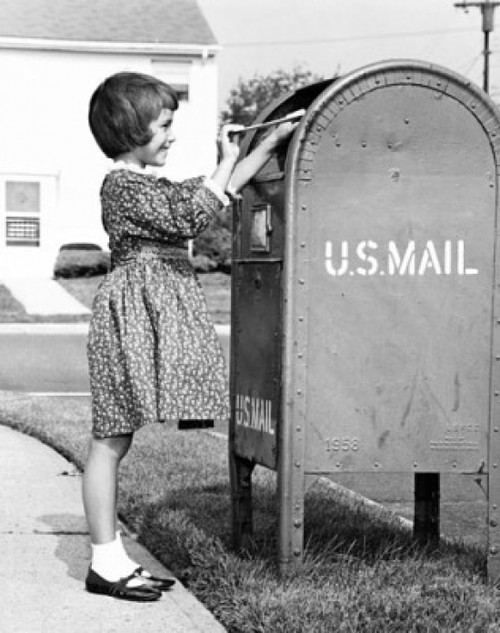 Girl putting a letter into a mailbox Poster Print - Item # VARSAL25532656