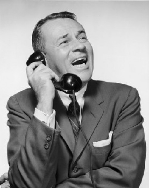 Mature businessman talking on telephone and laughing Poster Print - Item # VARSAL25548239