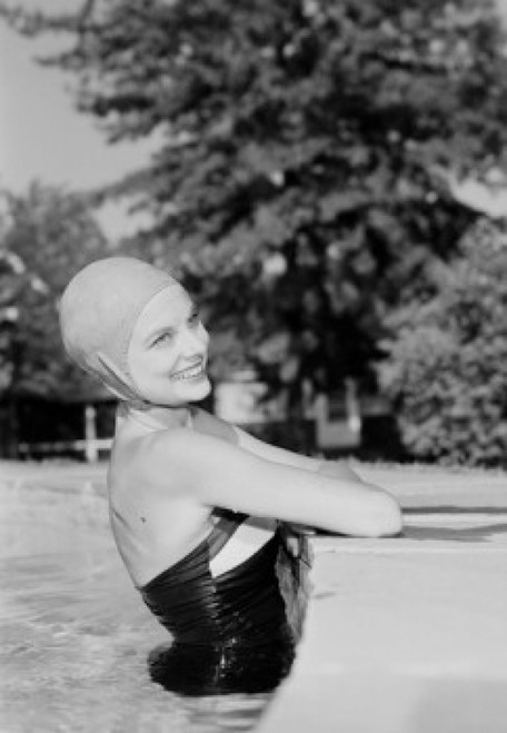 Young woman in outdoor swimming pool  smiling Poster Print - Item # VARSAL255420311 Young woman in outdoor swimming pool  smiling Poster Print - Item # VARSAL255420311
