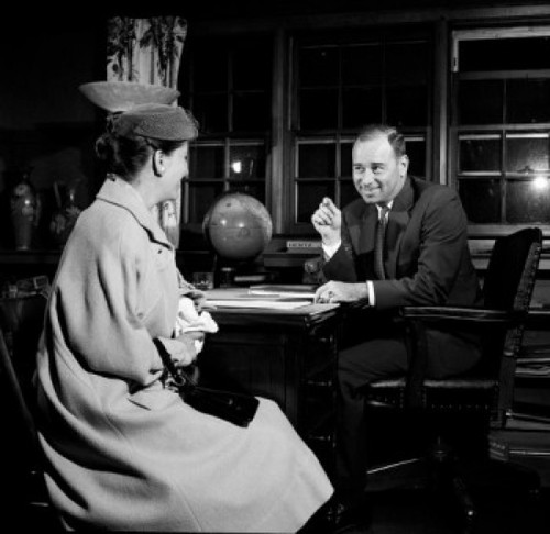 Businessman talking to woman in office Poster Print - Item # VARSAL255417575