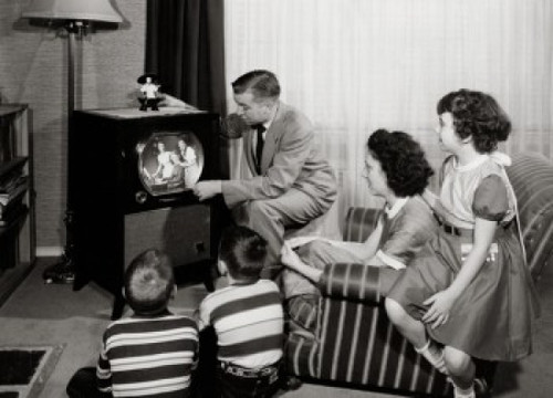 Parents with three children watching television Poster Print - Item # VARSAL25511264