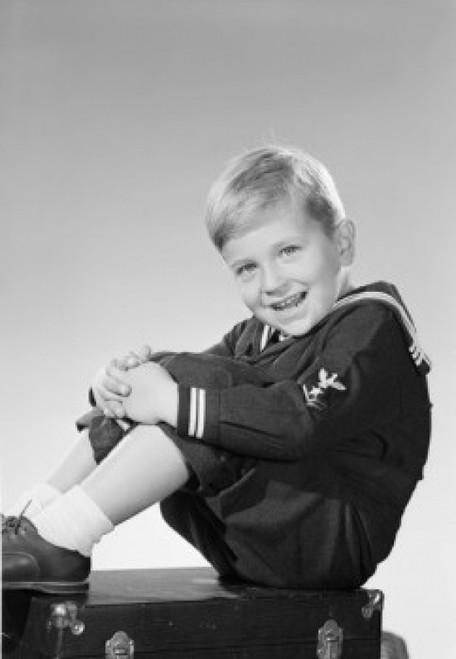 Portrait of boy sitting on suitcase Poster Print - Item # VARSAL255422898