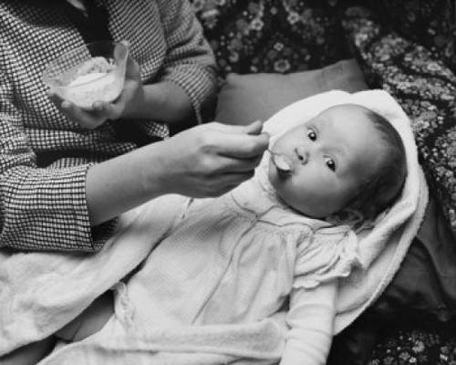 Mid section view of a woman feeding her daughter Poster Print - Item # VARSAL2559736B