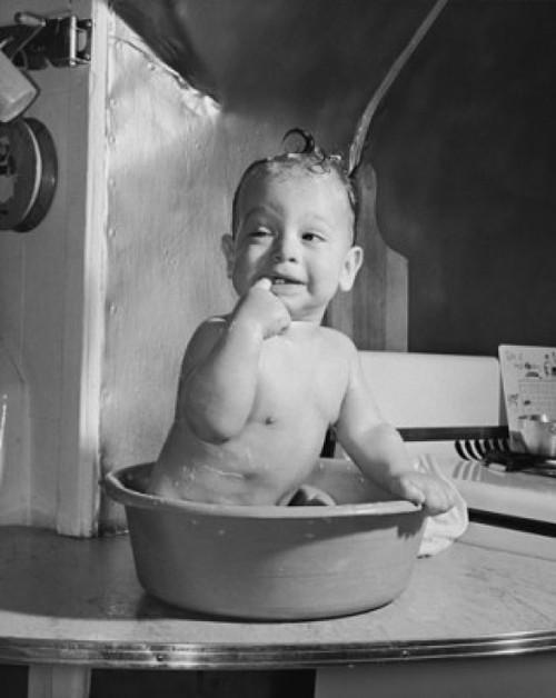 Baby in a bathtub with it's finger in it's mouth Poster Print - Item # VARSAL2559095A