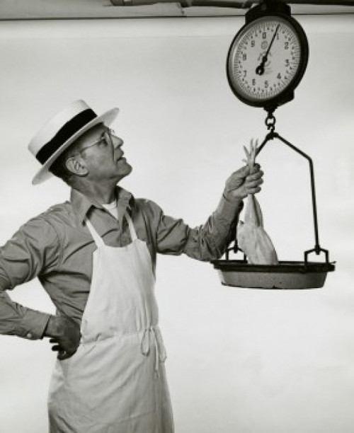 Butcher weighing a chicken Poster Print - Item # VARSAL2553594