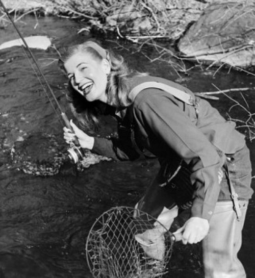 Young woman fishing in stream Poster Print - Item # VARSAL25518579