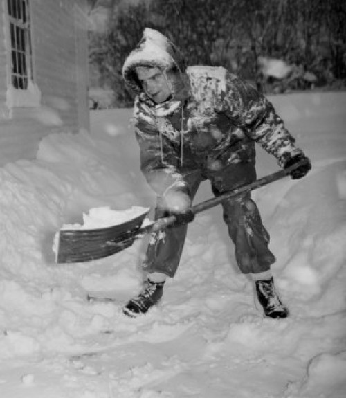 USA  Vermont  Woodstock  man shoveling snow Poster Print - Item # VARSAL255423557