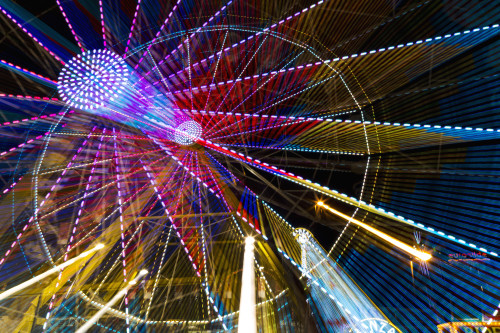 Colourful lights of a moving ferris wheel at nighttime; Calgary, Alberta, Canada PosterPrint - Item # VARDPI12285196