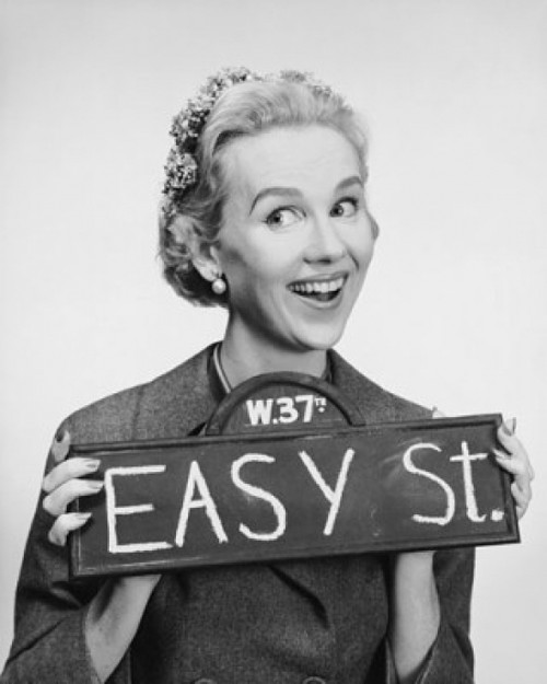 Close-up of a mid adult woman holding a street name sign Poster Print - Item # VARSAL25511418