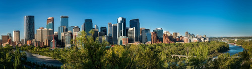 Skylines in a city, Bow River, Calgary, Alberta, Canada Poster Print by Panoramic Images - Item # VARPPI174061