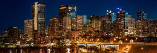 Illuminated bridge and skylines in a city, Center Street Bridge, Bow River, Calgary, Alberta, Canada Poster Print by Panoramic Images - Item # VARPPI174055
