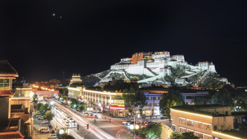 Conjunction of Venus and Jupiter above Potala Palace in Lhasa, Tibet, China. Poster Print by Jeff Dai/Stocktrek Images - Item # VARPSTJFD200060S