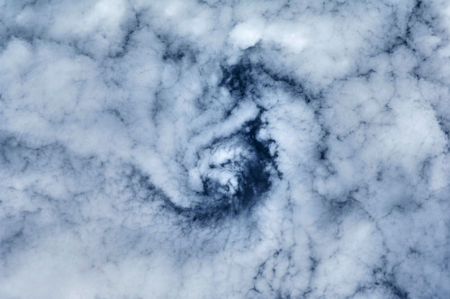 Satellite view of cloud spiral above Earth over Canada Poster Print by Panoramic Images - Item # VARPPI181133