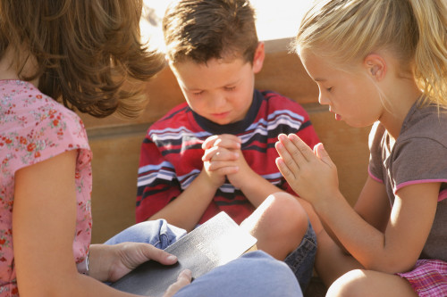 Children Praying Together Poster Print by Don Hammond / Design Pics - Item # VARDPI1781388
