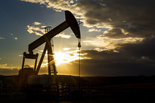 Silhouette of pump jack with dramatic storm clouds, blue sky and sunburst; Alberta, Canada Poster Print by Michael Interisano / Design Pics - Item # VARDPI12321685