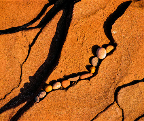 Pebbles on rocks at shoreline, Lake Superior, Keweenaw Peninsula, Upper Peninsula, Michigan, USA Poster Print by Panoramic Images - Item # VARPPI168195