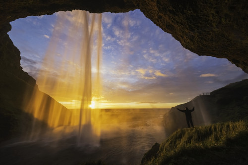 Man standing behind the waterfall known as Seljandafoss along the southern coast of Iceland; Iceland Poster Print by Robert Postma / Design Pics - Item # VARDPI12319538