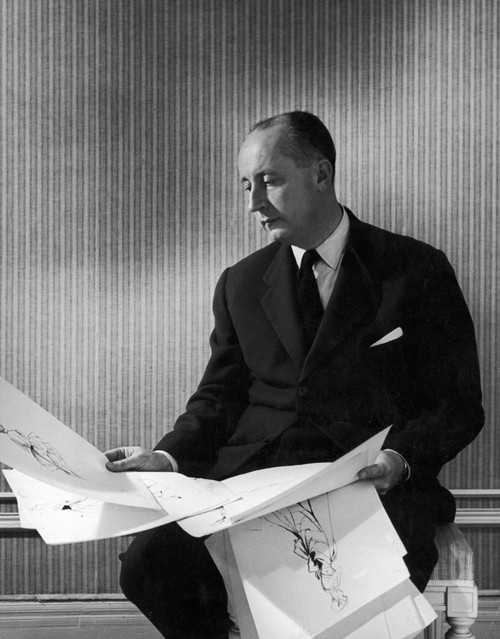 Christian Dior (1905-1957). /Nfrench Fashion Designer. Dior Looking Over Some Of His Sketches For Women'S Dresses, 1940S Or 1950S. Poster Print by Granger Collection - Item # VARGRC0108886