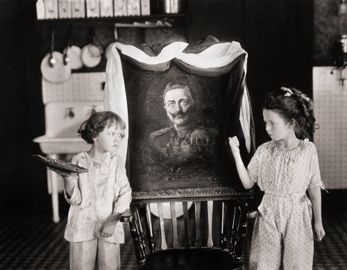 Silent Still: Children. /Njane (Left) And Katherine Lee Threatening To Give A Pie In The Face To A Painting Of Kaiser Wilhelm Ii Of Germany. Still From The 1918 Motion Picture 'Swat The Spy.' Poster Print by Granger Collection - Item # VARGRC0072416