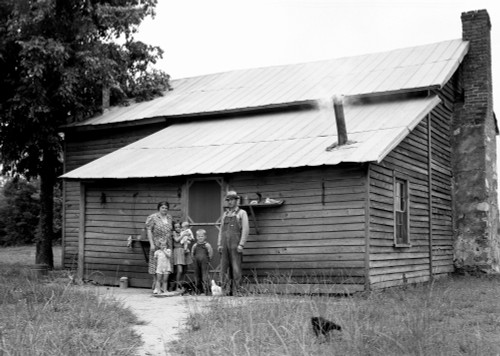 Sharecropper, 1939. /Na Tobacco Sharecropper With His Family At The Back Of Their Farmhouse In Person County, North Carolina. Photograph By Dorothea Lange, July 1939. Poster Print by Granger Collection - Item # VARGRC0123781