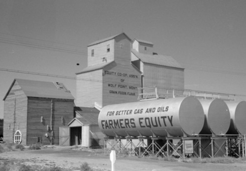 Montana: Farm, 1941. /Ngrain Elevators And Oil Tanks At A Farm In Wolf Point, Montana. Photograph By Marion Post Wolcott, 1941. Poster Print by Granger Collection - Item # VARGRC0353111