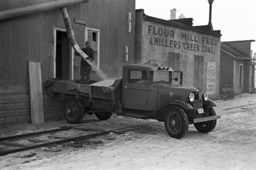 Iowa: Corn Mill, 1936. /Nloading Corn Kernels Onto A Truck From An Elevator Shoot, Spencer, Iowa. Photograph By Russell Lee, December 1936. Poster Print by Granger Collection - Item # VARGRC0121642