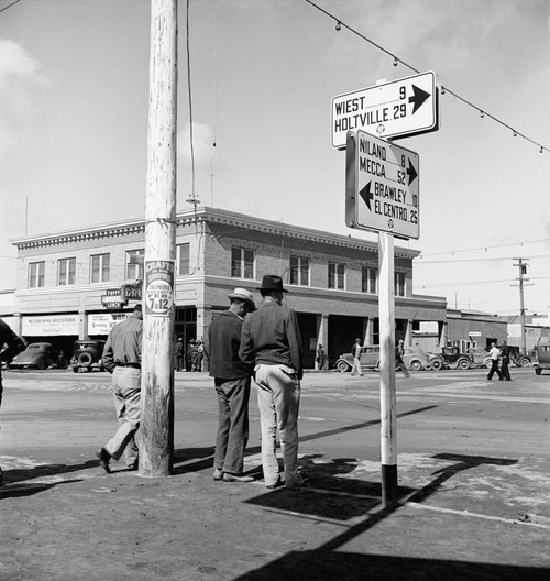 Pea Pickers, 1939. /Nidle Pea Pickers Discussing Prospects For Work On A Street Corner In Calipatria, Imperial Valley, California. Photograph By Dorothea Lange, February 1939. Poster Print by Granger Collection - Item # VARGRC0123102