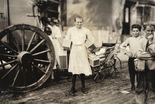 Hine: Home Industry, 1912. /Na Girl Carrying Several Boxes Of Garment Tags On The Street In Roxbury, Massachusetts. Photograph By Lewis Wickes Hine, August 1912. Poster Print by Granger Collection - Item # VARGRC0268263