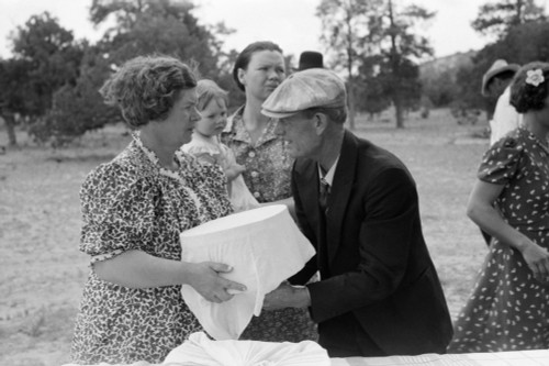 Community Dinner, 1940. /Nmrs. Stagg Handing A Pan Of Food To Her Husband To Set Out For Dinner At The All Day Community Sing In Pie Town, New Mexico. Photograph By Russell Lee, 1940. Poster Print by Granger Collection - Item # VARGRC0323240 Community Dinner, 1940. /Nmrs. Stagg Handing A Pan Of Food To Her Husband To Set Out For Dinner At The All Day Community Sing In Pie Town, New Mexico. Photograph By Russell Lee, 1940. Poster Print by Granger Collection - Item # VARGRC0323240