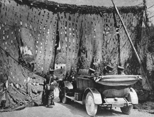 World War I: Camouflage. /Na Member Of The British Military Police Lifting A Camouflaged Screen To Permit A General Staff Car To Pass. Photograph, 1914-1918. Poster Print by Granger Collection - Item # VARGRC0407916