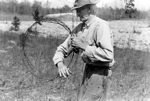 Farmer With Barbed Wire. /Na Farmer Rolling Up Old Barbed Wire Near Harleton, Texas. Photographed By Russell Lee, April 1939. Poster Print by Granger Collection - Item # VARGRC0119064