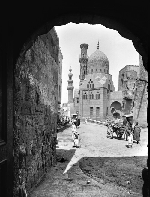 Egypt: Cairo. /Na Street Scene In Cairo With The Mosque Of Kait Bey In The Background. Photograph, C1920-33. Poster Print by Granger Collection - Item # VARGRC0120126