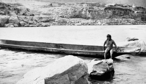 Dugout Canoe, C1897. /Na Native American Man Sitting On A Dugout Canoe On The Columbia River, Washington State. Photograph, C1897. Poster Print by Granger Collection - Item # VARGRC0125770