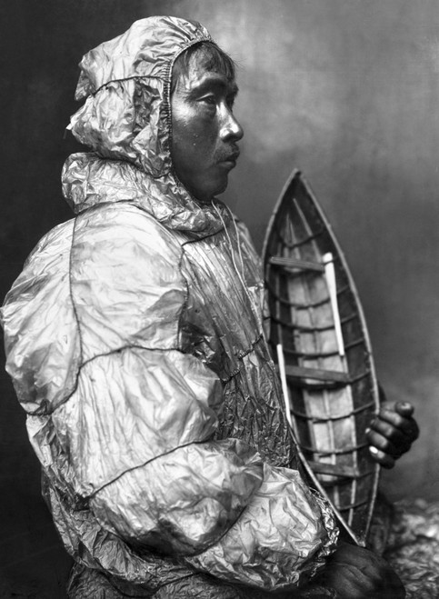 Alaska: Eskimo. /Nan Eskimo Kayaker Wearing A Waterproof Jacket And Holding A Toy Boat He Made For His Son. Photgraphed By The Lomen Brothers, Early 20Th Century. Poster Print by Granger Collection - Item # VARGRC0121176