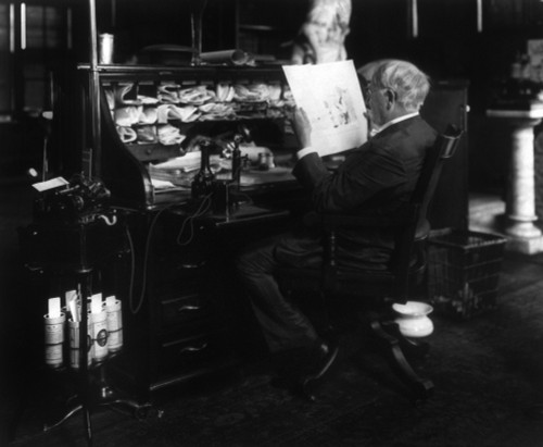 Thomas Edison (1847-1931). /Namerican Inventor. Photographed Seated At His Desk Reading Beside A Dictaphone That He Invented, C1914. Poster Print by Granger Collection - Item # VARGRC0119137