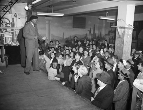 Jack Johnson (1878-1946). /Namerican Heavyweight Pugilist. Speaking At Hubert'S Museum And Flea Circus In Times Square, New York City. Photograph, C1945. Poster Print by Granger Collection - Item # VARGRC0526813