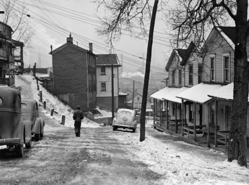 Aliquippa: Street, 1941. /Na Man Walking On A Snow Covered Street In Aliquippa, Pennsylvania. Photograph By Jack Delano, January 1941. Poster Print by Granger Collection - Item # VARGRC0122636