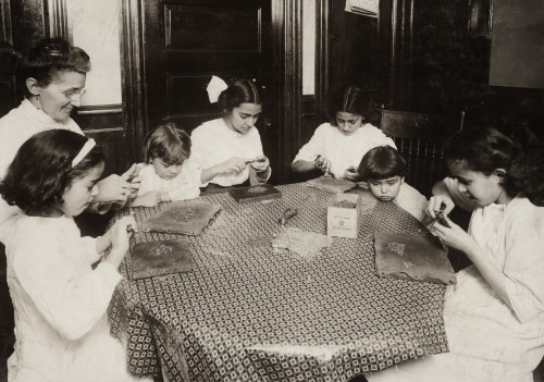 Hine: Home Industry, 1912. /Na Woman And Children Sitting Around A Table Making Chains For Handbags In A Tenement Apartment In New York City. Photograph By Lewis Hine, November 1912. Poster Print by Granger Collection - Item # VARGRC0167524