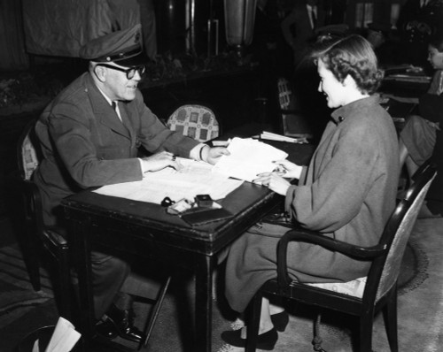 Immigration, C1920. /Na U.S. Immigration Official Inspecting An Immigrant'S Papers. Photograph, C1920. Poster Print by Granger Collection - Item # VARGRC0185820