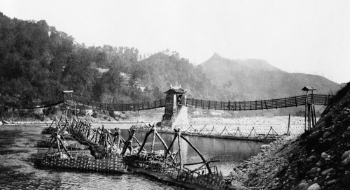 China: Suspension Bridge. /Na Chinese Built Suspension Bridge With Boats Docked At A Pier, Szechwan Province, China. Photograph, C1890-1923. Poster Print by Granger Collection - Item # VARGRC0114615