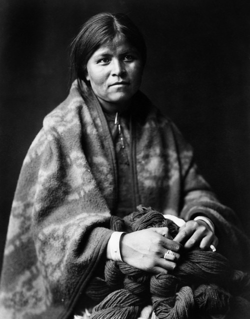 Navajo Woman, C1904. /N'The Blanket Maker.' A Navajo Woman Wrapped In A Blanket, Holding Yarn. Photograph By Edward Curtis, C1904. Poster Print by Granger Collection - Item # VARGRC0117222