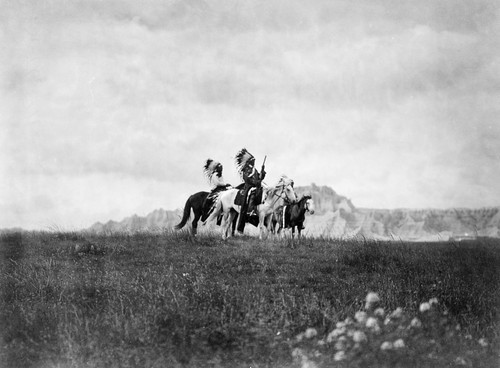 Sioux Horsemen, C1905. /Na Group Of Three Sioux Native American Men On Horseback In The Great Plains, With A Rock Formation In The Background. Photographed By Edward S. Curtis, C1905. Poster Print by Granger Collection